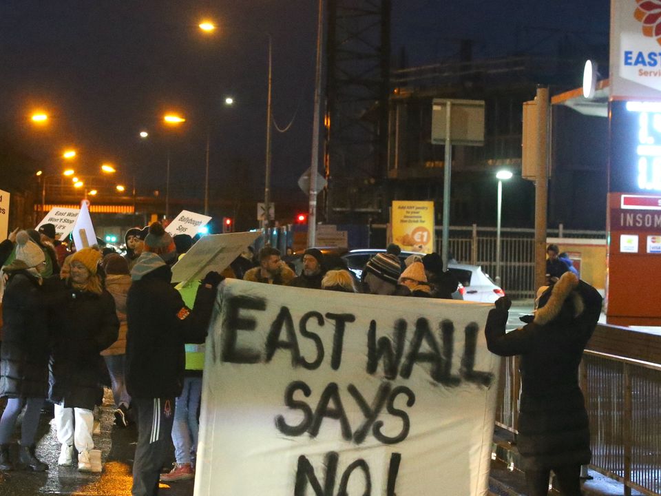 People gather for a protest in Dublin's East Wall over temporary housing for refugees. Photo: Stephen Collins
