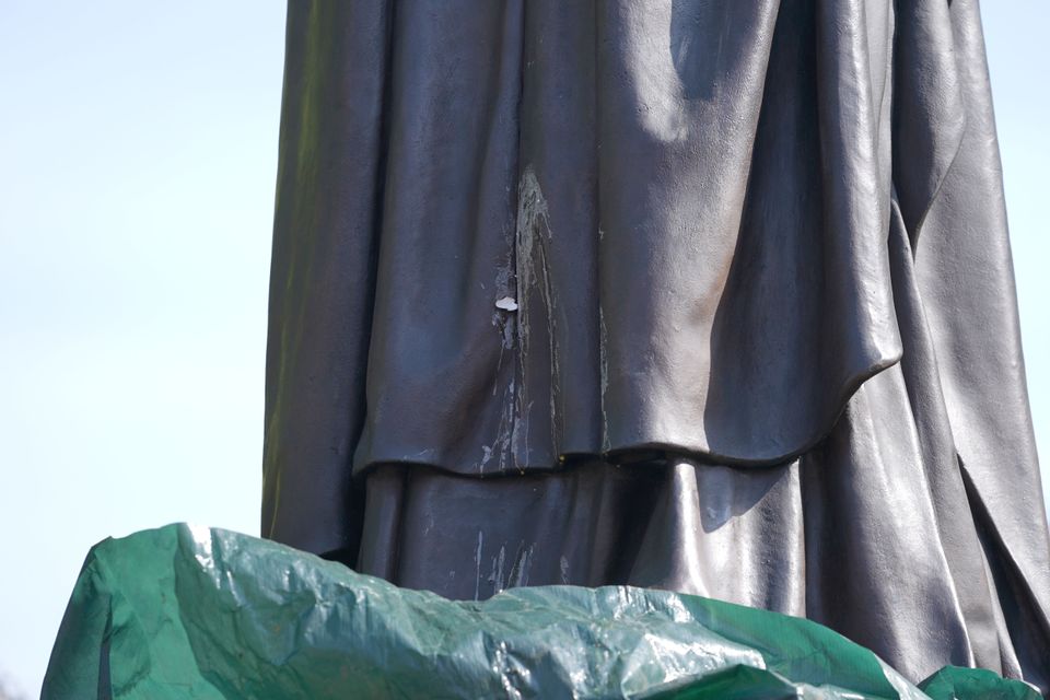 The contents of a thrown egg drip down the newly-installed statue of Baroness Margaret Thatcher (Joe Giddens/PA)