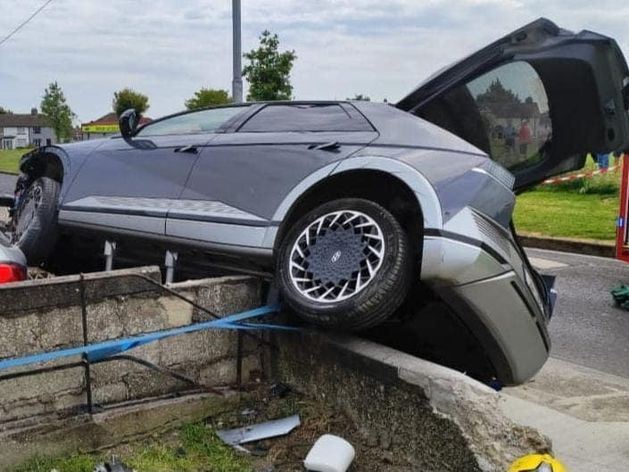 Dublin Fire Brigade images show car delicately balanced on wall after crash