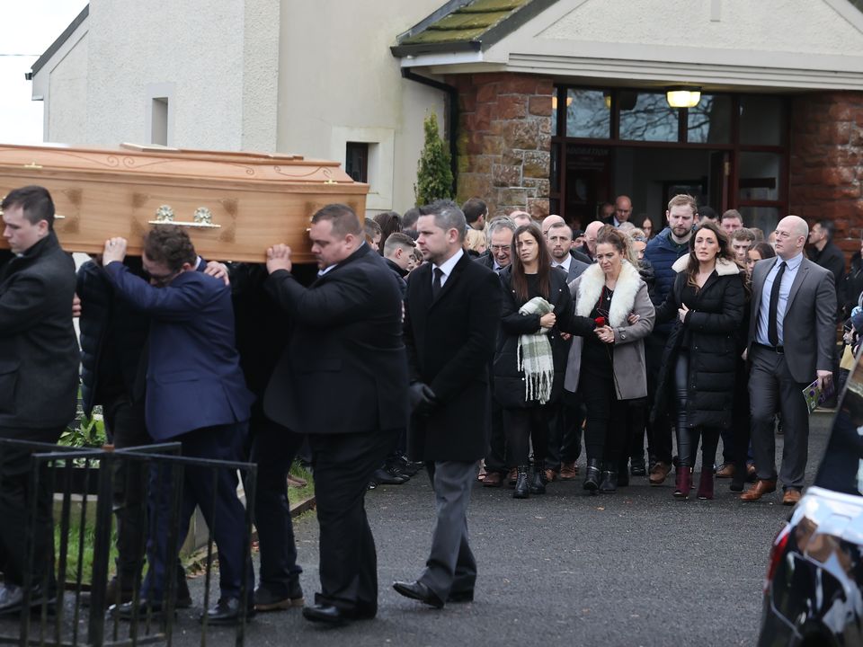 The coffin of Patrick Rogers is carried from his funeral service at St Joseph and St Malachy's Church, Drummullan. Picture date: Friday December 30, 2022.