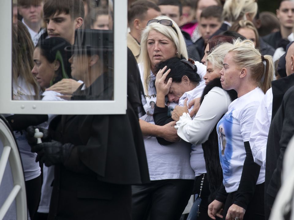 Margaret Cash McDonagh, mother of the three victims is consoled as her children's remains are put into the horse drawn carriage.  Photo: Colin Keegan, Collins Dublin