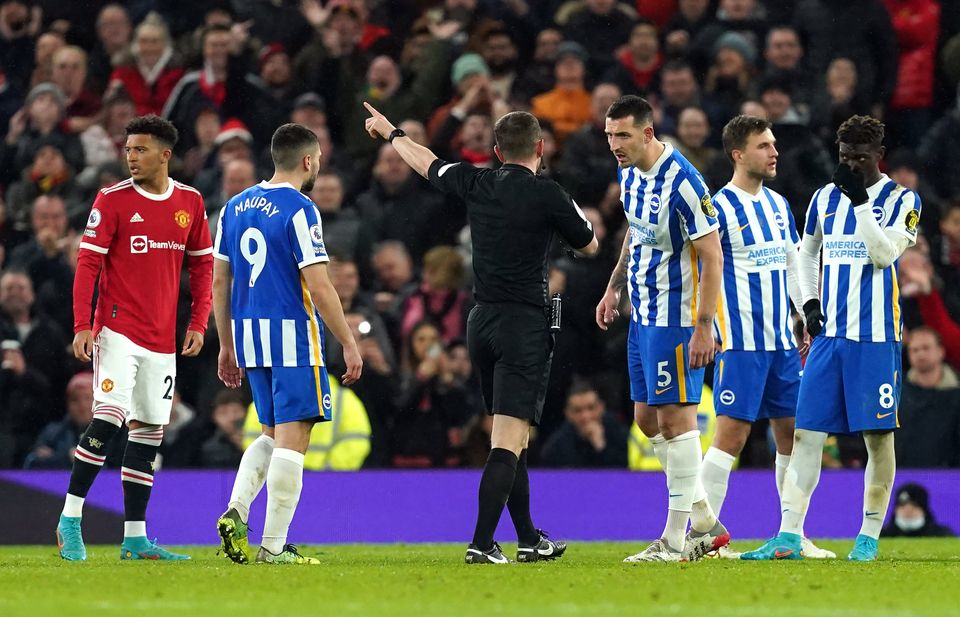 Referee Peter Bankes showed a red card to Brighton’s Lewis Dunk (Martin Rickett/PA)