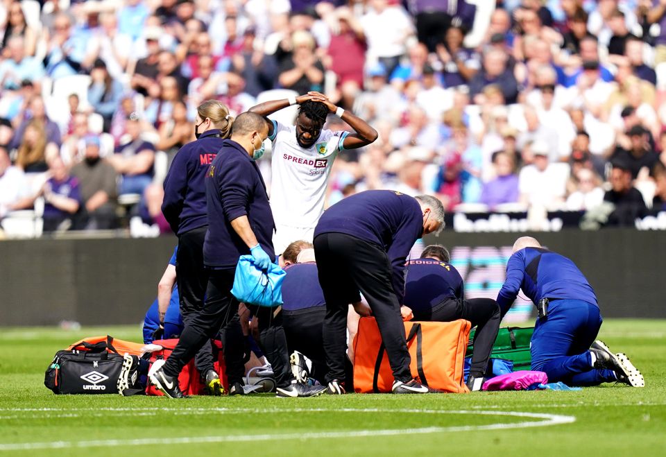 Ashley Westwood receives treatment on the pitch (Adam Davy/PA)