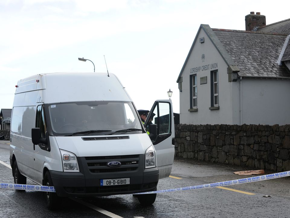 27/1/2013; Gardai outside Lordship Credit Union, where Det Garda Adrian Donohoe was killed during an attemptred armed robbery. Picture credit; Damien Eagers