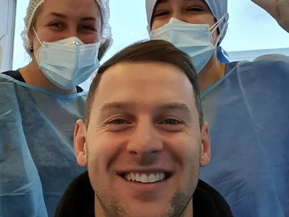 Philly McMahon showing off his new teeth