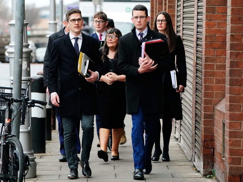 Enoch Burke arrives in court supported by family members