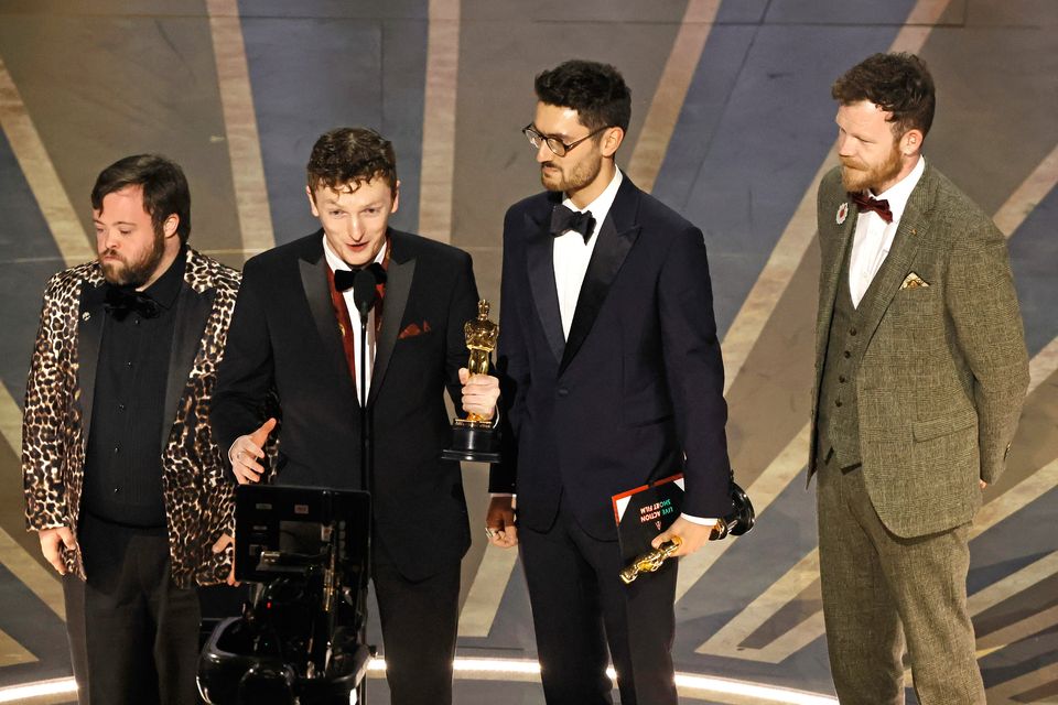 (L-R)  Ross White holding the Oscar for Best Live Action Short Film award for "An Irish Goodbye"pictured with James Martin, Tom Berkeley, and Seamus O'Hara onstage during the 95th Annual Academy Awards at Dolby Theatre on March 12, 2023 in Hollywood, California. (Photo by Kevin Winter/Getty Images)