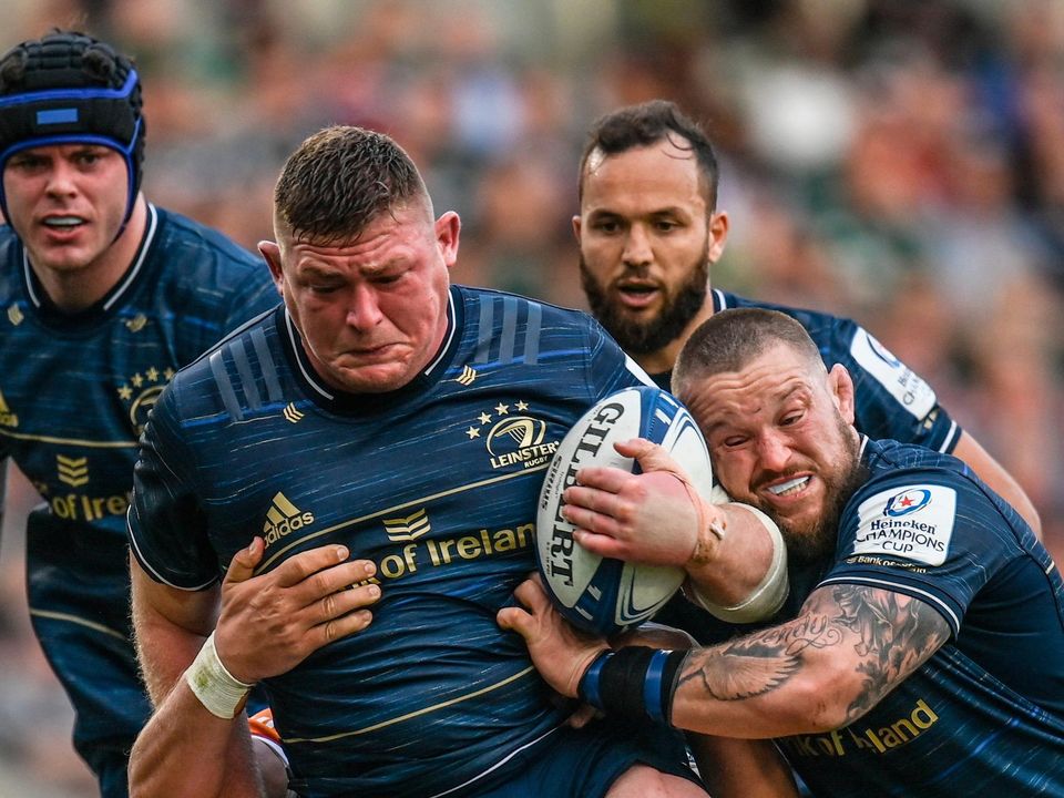 Tadhg Furlong of Leinster, supported by teammate Andrew Porter, is tackled by Calum Green of Leicester Tigers during the Heineken Champions Cup quarter-final at Welford Road Stadium in Leicester, England. Photo: Harry Murphy/Sportsfile
