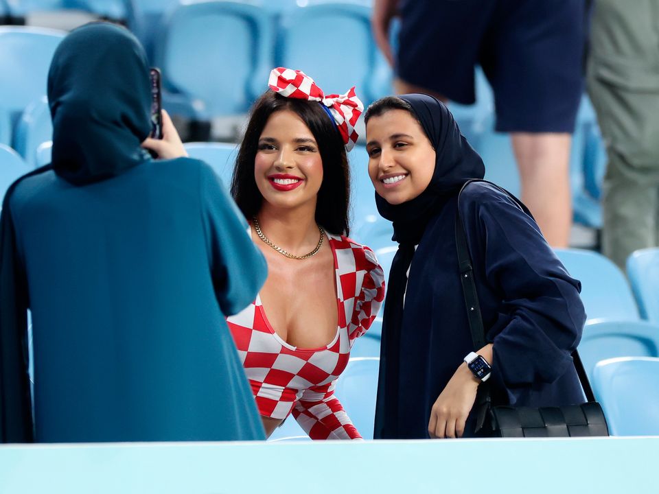 AL WAKRAH, QATAR - DECEMBER 05: Ivana Knoll, former Miss Croatia poses for a photo with the fans prior to the FIFA World Cup Qatar 2022 Round of 16 match between Japan and Croatia at Al Janoub Stadium on December 05, 2022 in Al Wakrah, Qatar. (Photo by Alex Grimm/Getty Images)