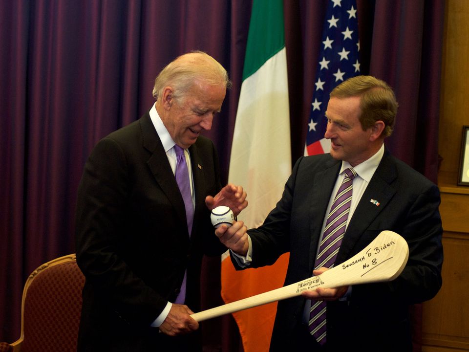 Joe Biden receives an hurl as welcome gift from then-Taoiseach Enda Kenny during a welcome ceremony at the Government Buildings in Dublin when Biden was US vice-president in 2016. Photo: Getty