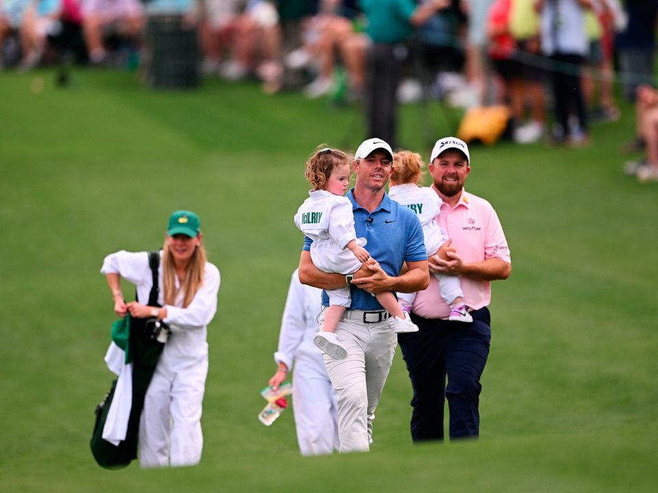 Irish pair McIlroy and Lowry walk up the first fairway
