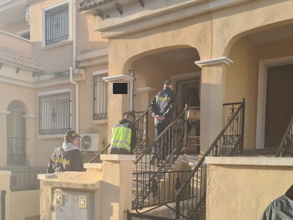 Police raid a home in Spain. Photo: An Garda Siochana