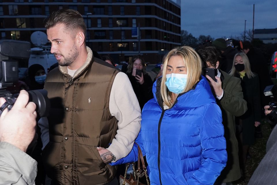 Katie Price with Carl Woods leaving Crawley Magistrates’ Court on Wednesday(Ian West/PA)
