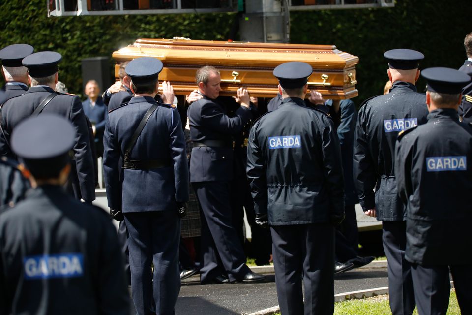 Officers carry the coffin at the funeral of Garda Colm Horkan