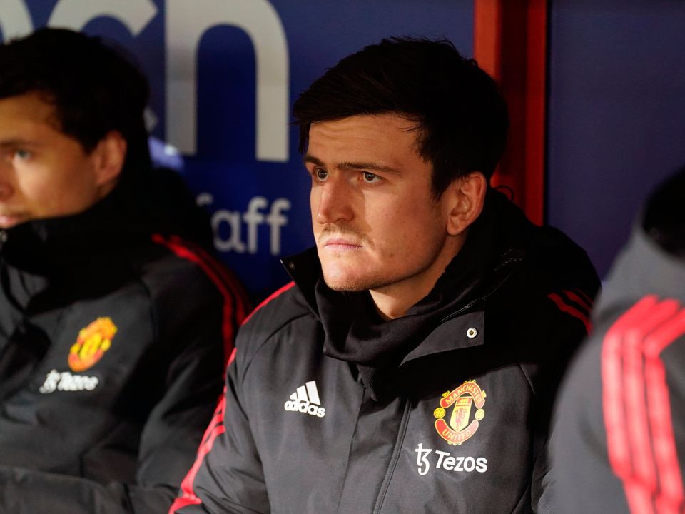 Harry Maguire on the Manchester United substitutes' bench. Maguire is one of the big names who may have to leave to Old Trafford to help Erik ten Hag's rebuilding job. Photo: Adam Davy/PA Wire