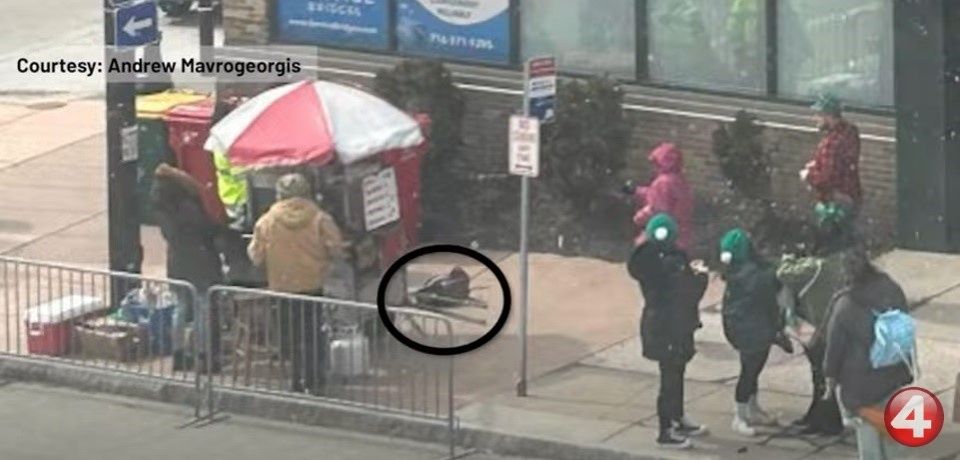 The gun landed on the footpath just feet away from pedestrians. Photo: WIVB-TV/Andrew Mavrogeorgis