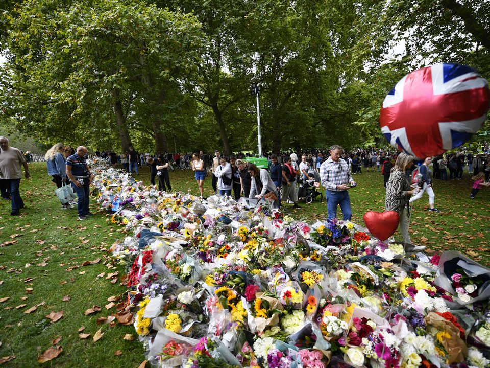 Well-wishers view floral tributes in Green Park, London, following the death of Queen Elizabeth II on Thursday. Picture date: Saturday September 10, 2022.