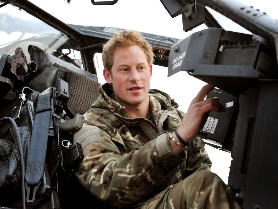 Prince Harry or Captain Wales as he was known in the British Army, making his early morning pre-flight checks in the cockpit, at Camp Bastion, southern Afghanistan.