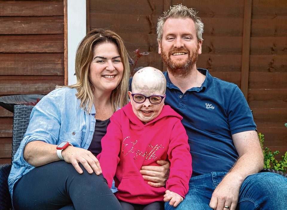 Elizabeth Soffe, 7 is running a mile a day to raise money for Birmingham Children's Hospital. Her parents are Liam and Sinead