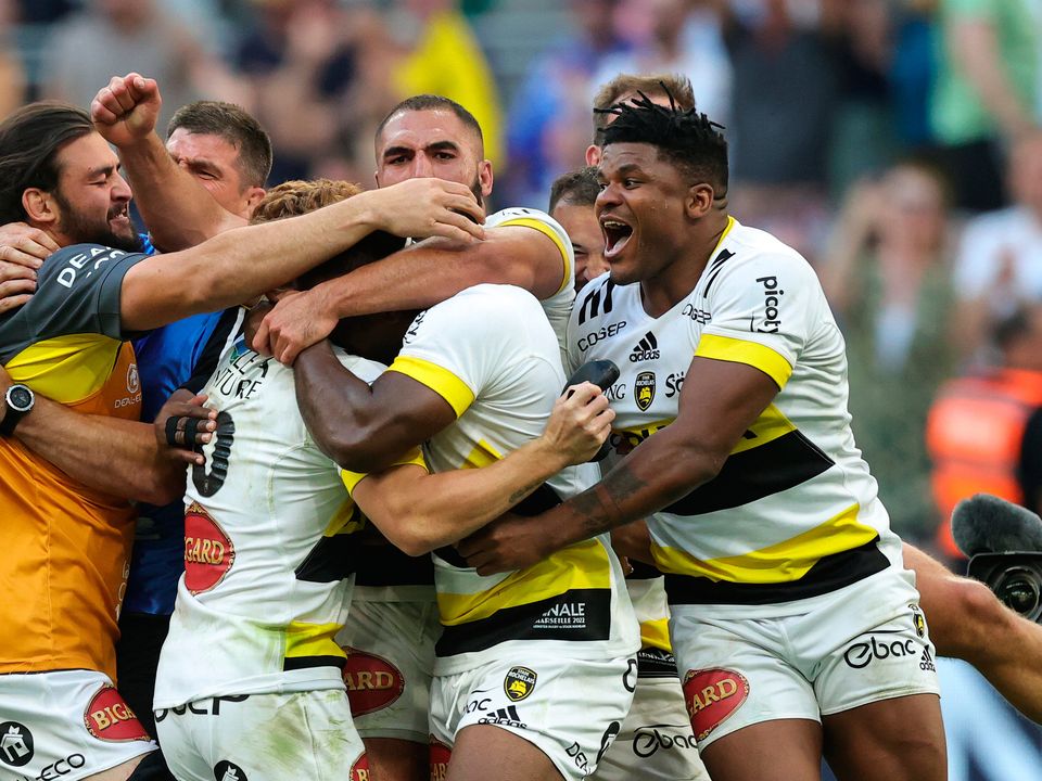 Ihaia West of La Rochelle, is mobbed by team mates after kicking the last minute conversion to confirm their victory during the Heineken Champions Cup Final match between Leinster Rugby and La Rochelle at Stade Velodrome. (Photo by David Rogers/Getty Images)