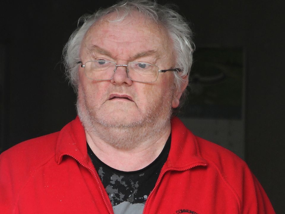 Reporter Steven Moore, conforts former Eucharistic Minister Bernard McNamee, who was recently found guilty of historic sexual abuse of a friends child