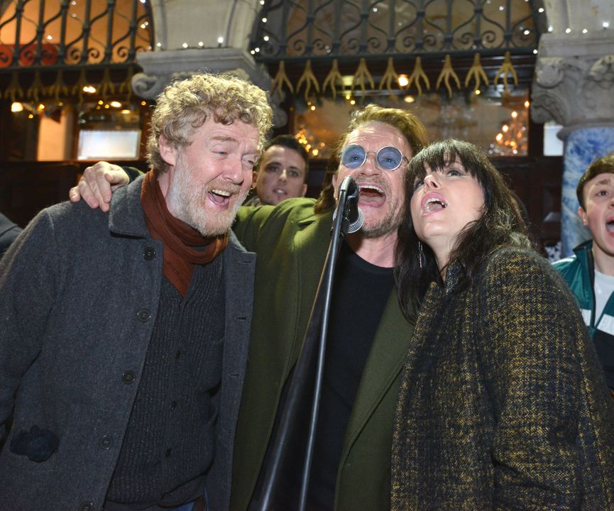 Oscar winner Glen Hansard, Bono from U2 and Imelda May entertain last minute shoppers during the annual Christmas Eve busk for the homeless in Dublin city centre, Photo credit: Barbara Lindberg.