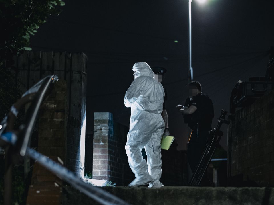 Police at the scene of a shooting incident in the Whitecliff Parade area of west Belfast on March 30th 2023 (Photo by Kevin Scott)