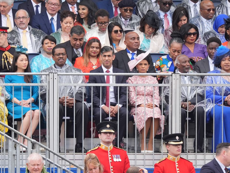 Prime Minister Rishi Sunak (centre left) and his wife Akshata Murty (centre right) sit in the crowd during the Trooping the Colour ceremony (Yui Mok/PA)