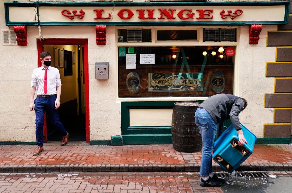 Staff working at Kehoes pub in Dublin’s city centre. People can look forward to an earlier than planned lifting of restrictions, Taoiseach Micheál Martin has said. Photo: Brian Lawless/PA Wire