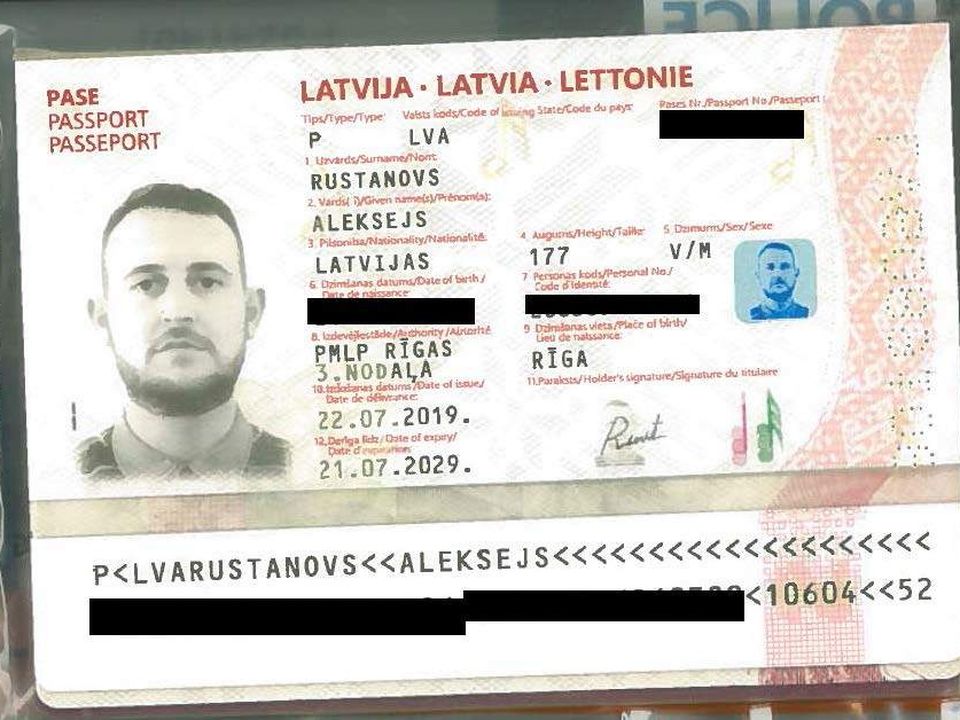 A fake passport issued to killer Christopher Hughes