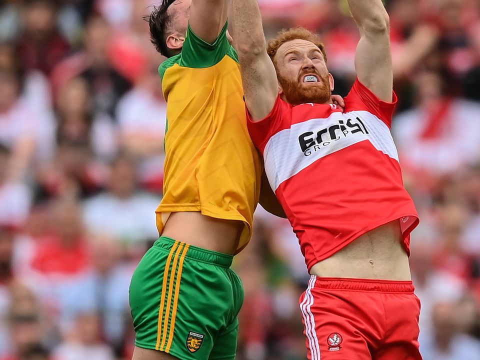 Conor Glass of Derry in action against Jason McGee of Donegal during the Ulster SF Final. Photo: Stephen McCarthy/Sportsfile