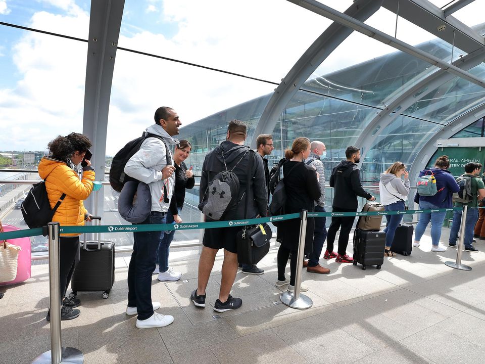 Passengers queue in the walkway into departures at Terminal 2 at Dublin Airport last month. Picture by Frank McGrath