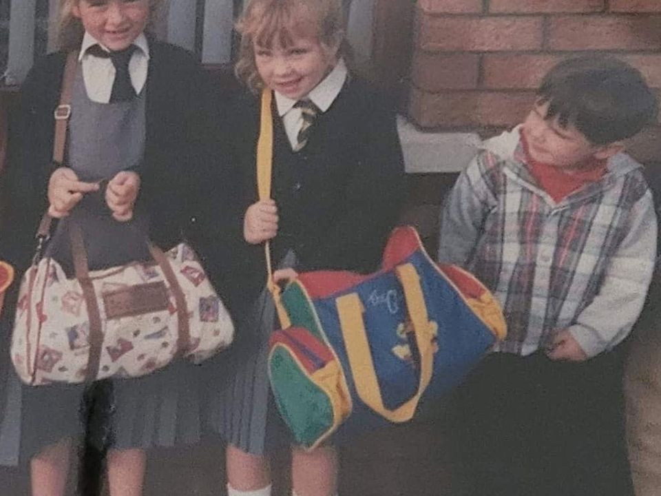 Natalie, centre, with Jayne on their first day at school. Also pictured is Natalie’s brother Niall.