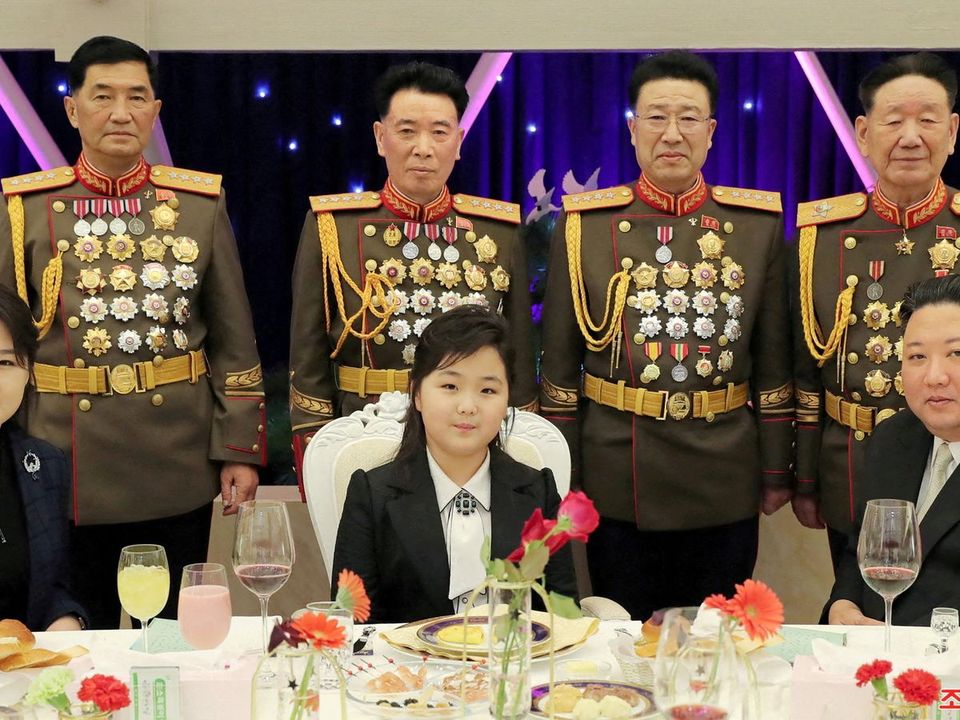 Kim with his daughter Kim Ju Ae and his wife Ri Sol Ju at the banquet