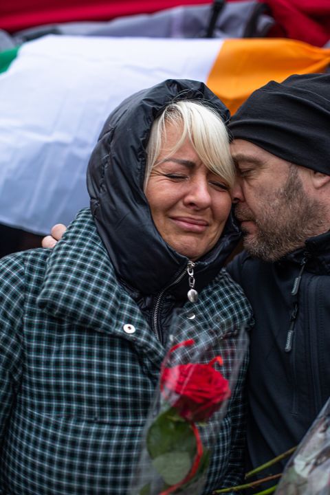 Kseniya Muraskova from Ukraine sheds a tear as she receives a red rose for International Women's Day from Aigars Joksts from Kimmage in Dublin at the refugee reception centre in Medyka, Poland (Photo: Mark Condren)