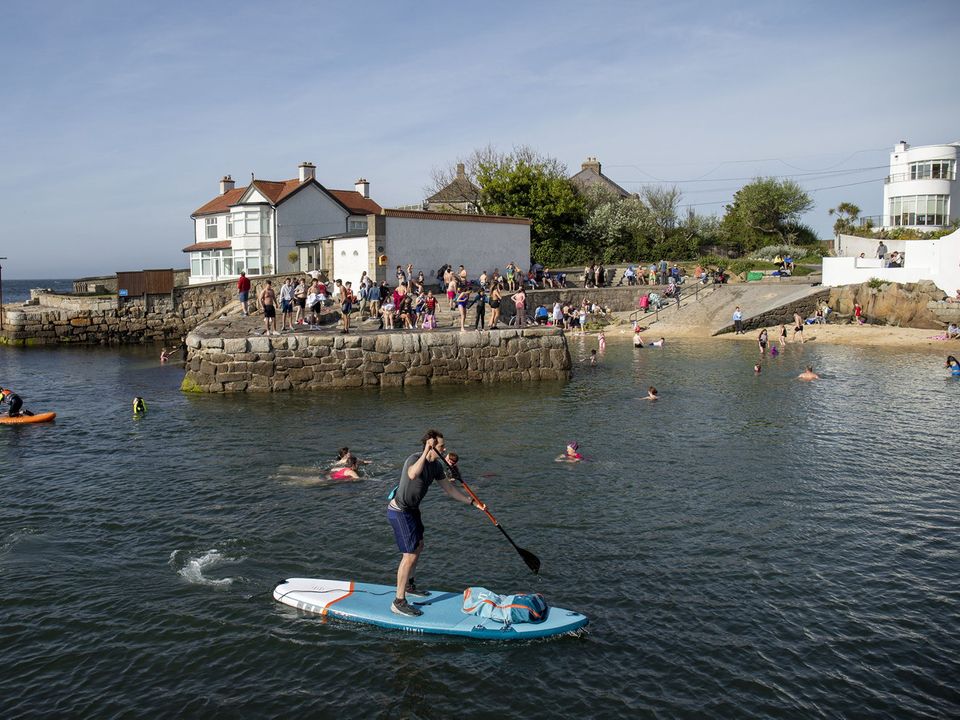 People enjoying the fine weather at Sandycove and the Forty Foot, Dublin. PIC: Conor Ó Mearáin / Collins Photos