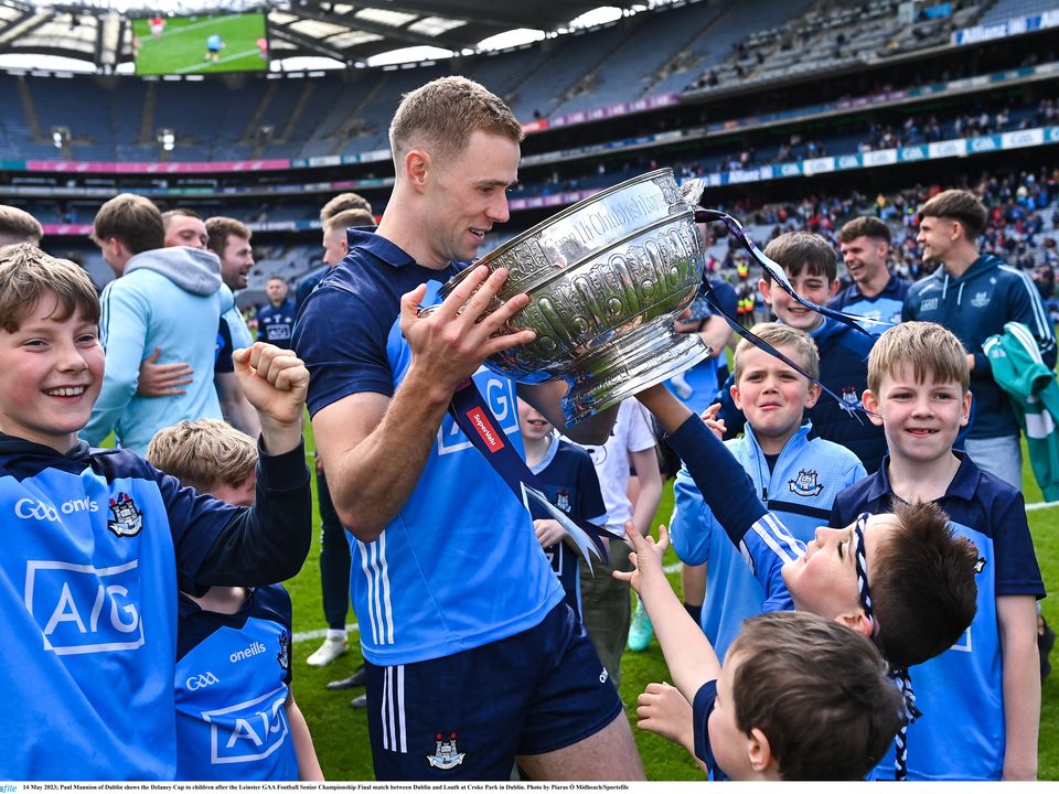 14 May 2023; Paul Mannion of Dublin shows the Delaney Cup to children after the Leinster GAA Football Senior Championship Final match between Dublin and Louth at Croke Park in Dublin. Photo by Piaras Ó Mídheach/Sportsfile