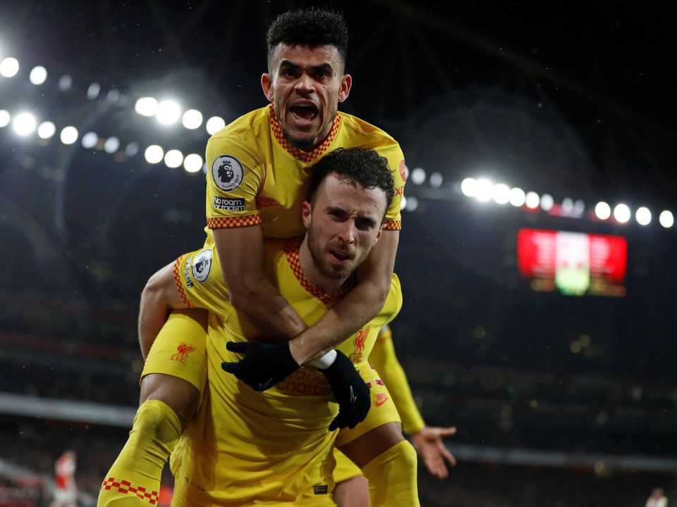 Liverpool's Portuguese striker Diogo Jota celebrates scoring the opening goal with Liverpool's Colombian midfielder Luis Diaz at Arsenal.