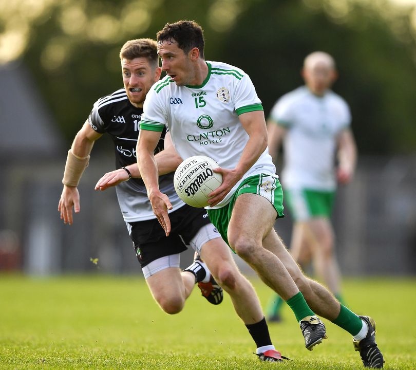 Christopher Farley of London races clear of Keelan Cawley of Sligo. Photo: Ray McManus/Sportsfile