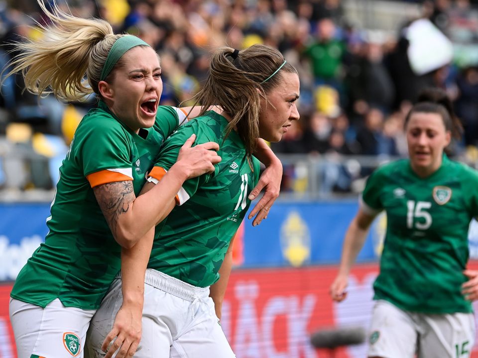 Katie McCabe celebrates with team-mate Denise O'Sullivan, left, after scoring against Sweden. Photo by Stephen McCarthy/Sportsfile