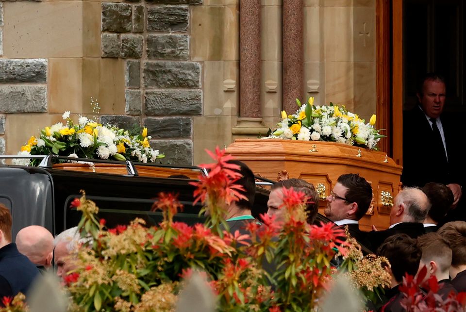 The coffins of Dan and Christine McKane, two of the three victims of the Aughnacloy crash, are carried into the Church of The Immaculate Conception in Strabane, for their funeral. Pic: Liam McBurney/PA Wire