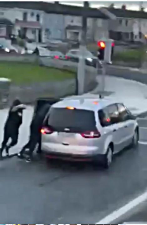 Thugs armed with a hammer attack a man in the street and bundle him into a car