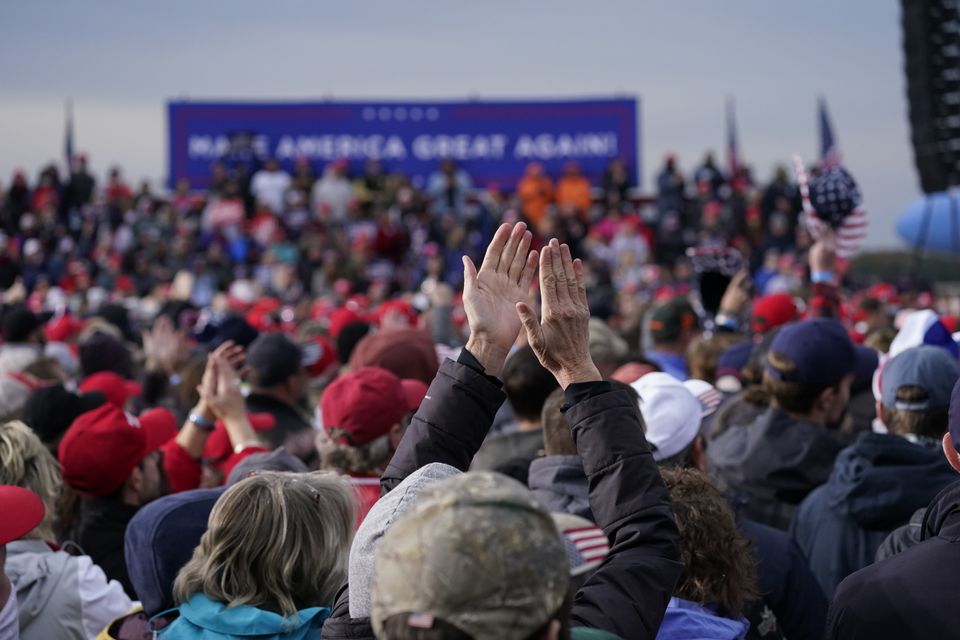 Supporters cheer Donald Trump as he speaks during the campaign rally at Muskegon County Airport (Alex Brandon/AP)
