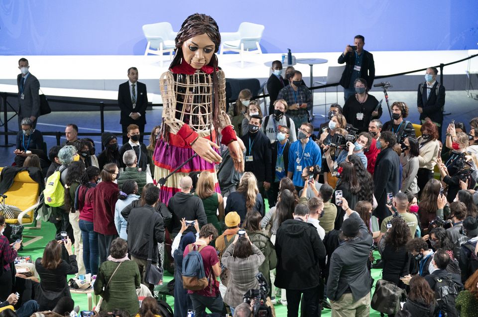 Little Amal visits the Action Zone at the Cop26 summit (Jane Barlow/PA)