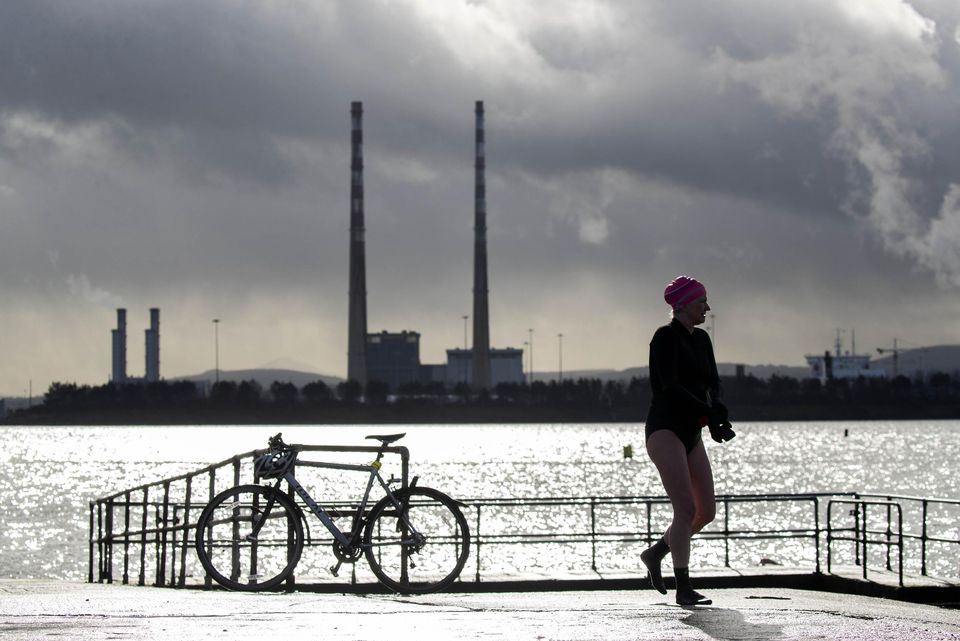 Swimmer Lynn Feeney prepares to swim as storm clouds gather in Clontarf this afternoon in advance of Storm Eunice, which is due to roll across the country from the early hours of tomorrow morning. Picture Colin Keegan, Collins Dublin