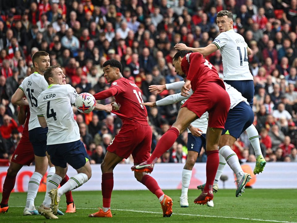 Liverpool's Dutch defender Virgil van Dijk (3R) sees this header blocked during the English Premier League football match between Liverpool and Tottenham Hotspur at Anfield in Liverpool, north west England on April 30, 2023. (Photo by Paul ELLIS / AFP) / RESTRICTED TO EDITORIAL USE. No use with unauthorized audio, video, data, fixture lists, club/league logos or 'live' services. Online in-match use limited to 120 images. An additional 40 images may be used in extra time. No video emulation. Social media in-match use limited to 120 images. An additional 40 images may be used in extra time. No use in betting publications, games or single club/league/player publications. /  (Photo by PAUL ELLIS/AFP via Getty Images)