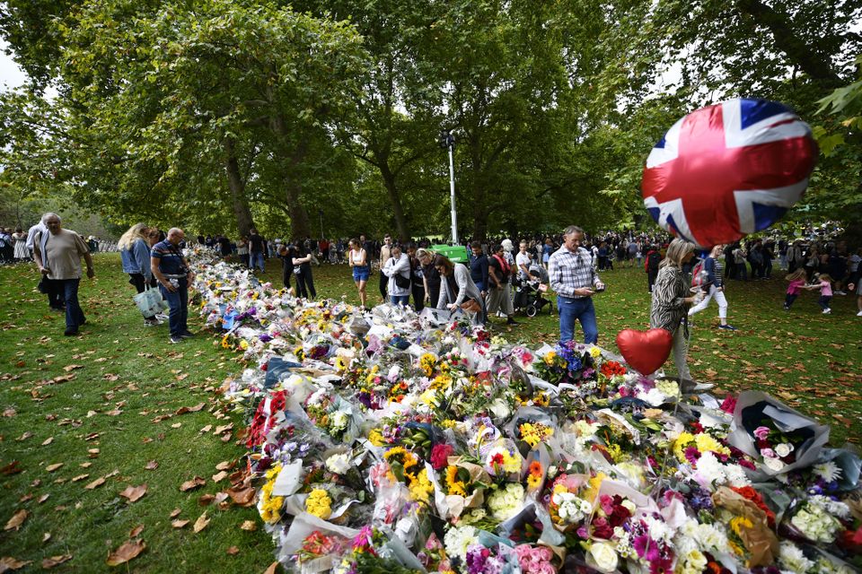 Well-wishers view floral tributes in Green Park, London, following the death of Queen Elizabeth II on Thursday. Picture date: Saturday September 10, 2022.