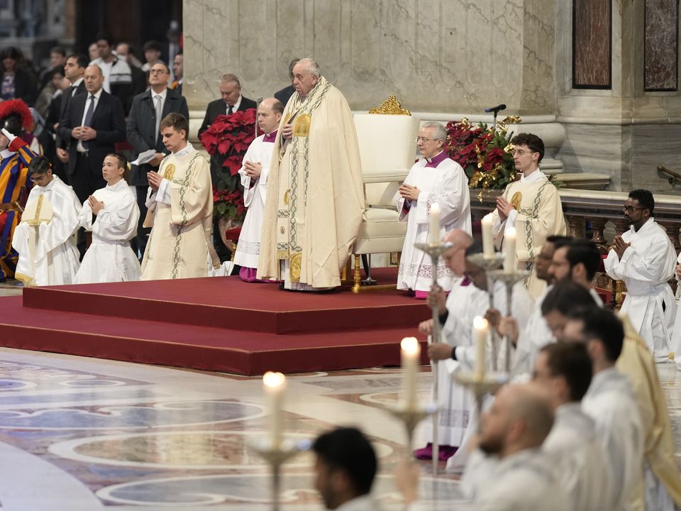 Pope Francis holds a Mass for the solemnity of St. Mary at the beginning of the new year, in St. Peter's Basilica at the Vatican, Sunday, Jan. 1, 2023. Pope Emeritus Benedict XVI, the German theologian who will be remembered as the first pope in 600 years to resign, has died, the Vatican announced Saturday. He was 95. (AP Photo/Andrew Medichini)