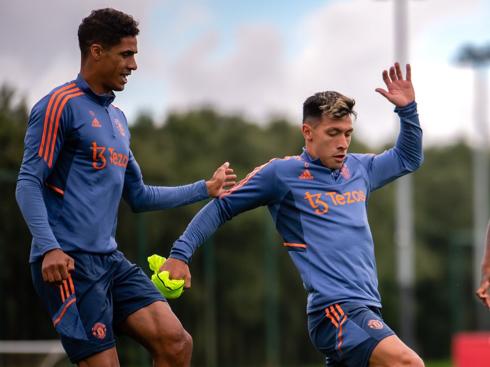 Raphael Varane (left) and Lisandro Martinez could have a bit of banter when they could face to face in the Man United dressing room. Photo: Ash Donelon/Manchester United via Getty Images