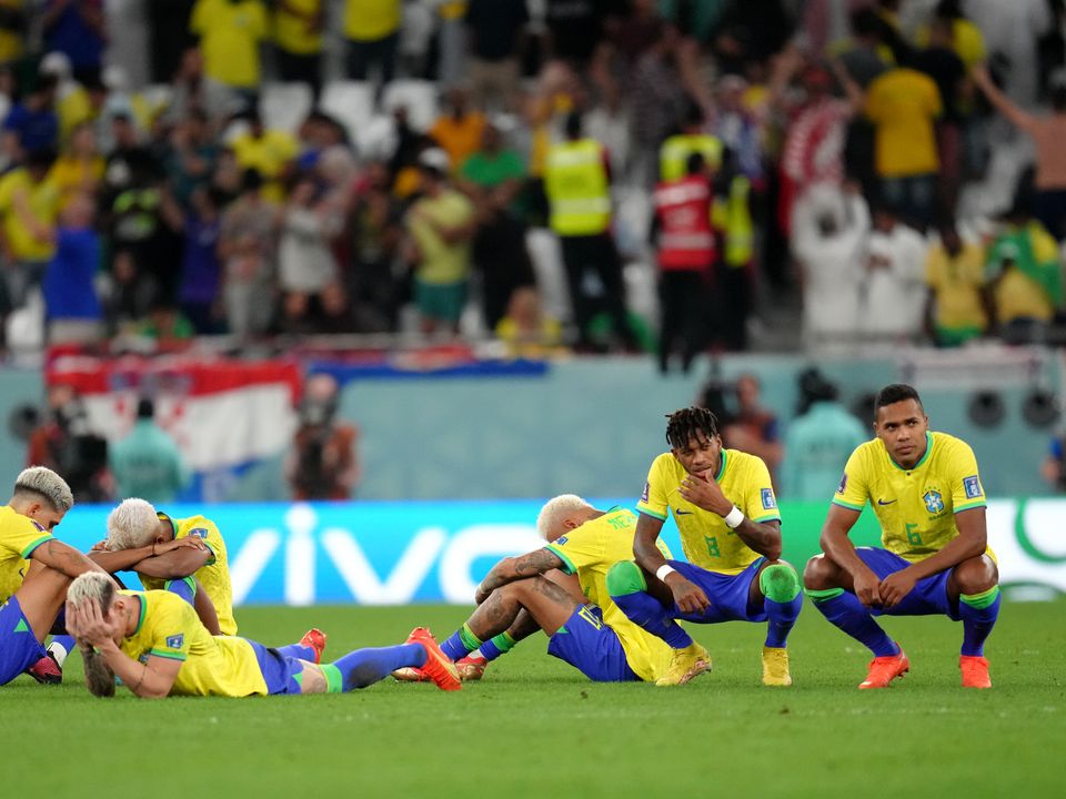 Brazil players react to defeat in a penalty shoot-out following the FIFA World Cup Quarter-Final match at the Education City Stadium in Al Rayyan, Qatar. Picture date: Friday December 9, 2022.